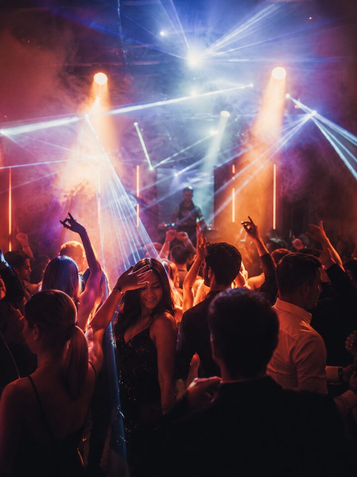 People dancing at an event with DJ KATO